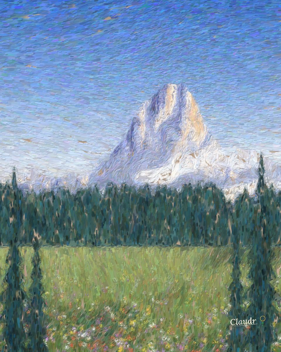 A towering snow-and-rock peak catches gold morning light above a band of cloud wrapped around its waist, with dark conifer forest and a wildflower meadow below.